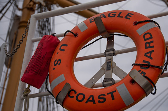 Life ring and rescue line bag at the ready aboard U.S. Eagle of the USCG